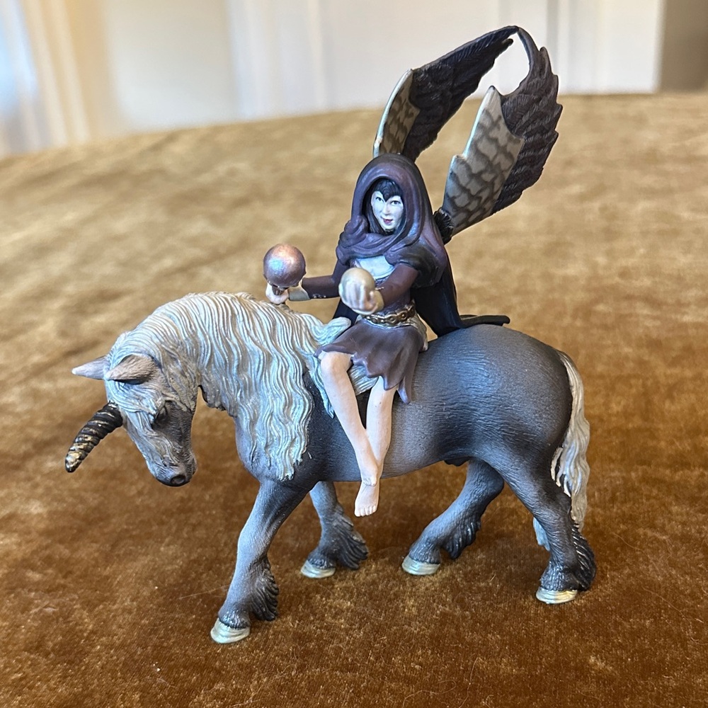 Mystical Figurine with Unicorn and Hooded Figure